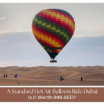 Hot air balloon Dubai sunrise over desert dunes
