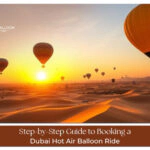 Hot air balloon flying over Dubai desert at sunrise view